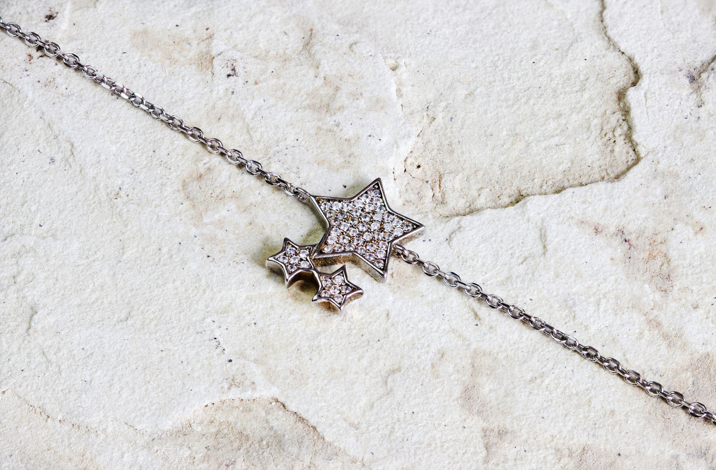 Dahlia Jewels presents a sterling silver necklace with sparkling star pendants, creating a constellation around your neck. A perfect blend of whimsy and elegance, with free jewellery delivery in Nairobi.