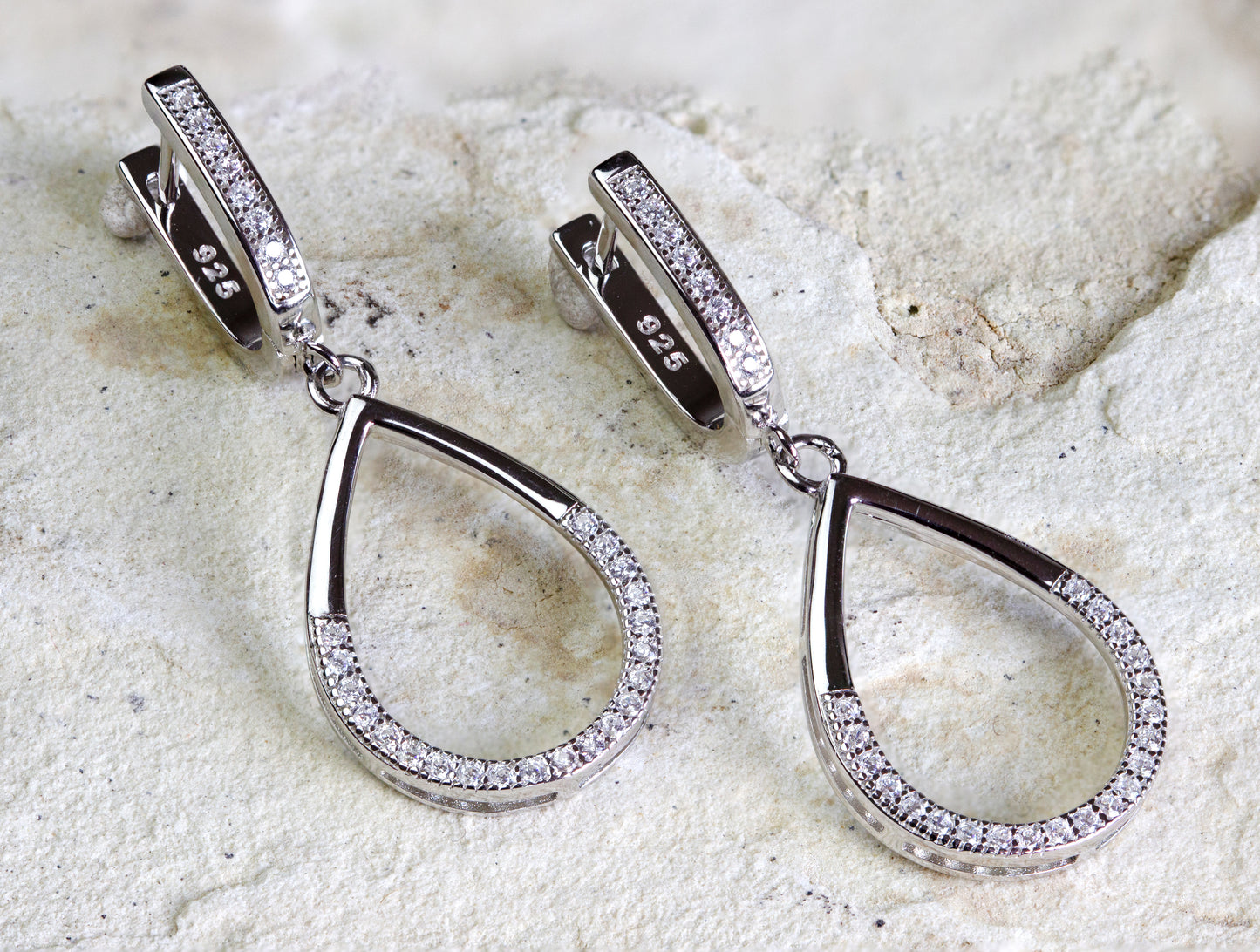 Elegant silver-toned teardrop earrings with a halo of crystals, designed for sophisticated events, with free shipping in Nairobi #gorgeouseveryday
