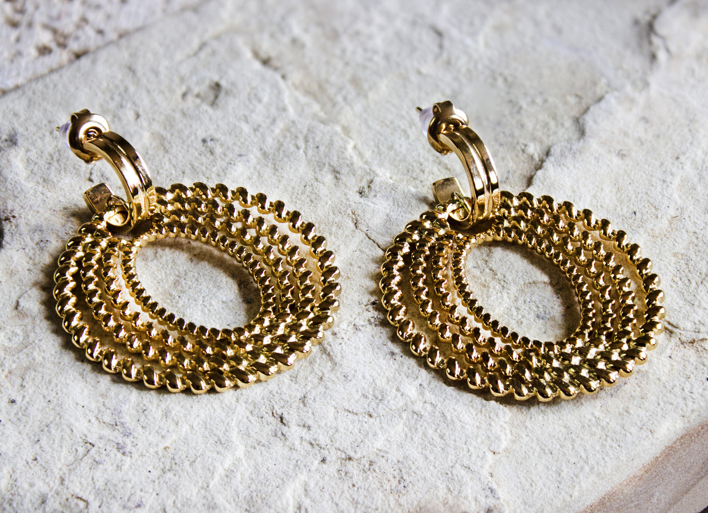 Golden circular mesh drop earrings with a lever back, perfect for adding a touch of sparkle and texture to any outfit, available for free delivery in Nairobi #gorgeouseveryday