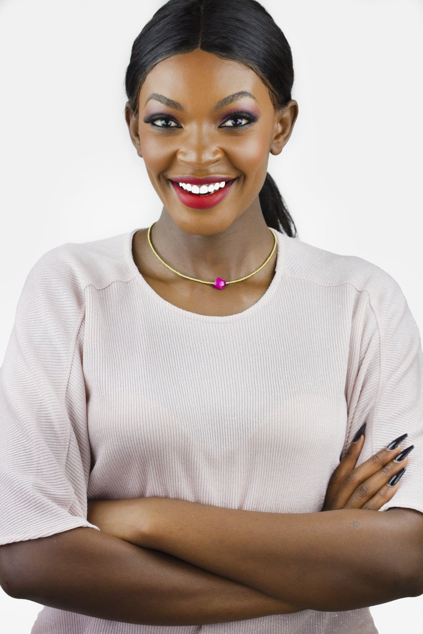 Dahlia Jewels brings you the epitome of elegance with their sleek gold choker and vibrant pendant. Enjoy free jewellery delivery in Nairobi!