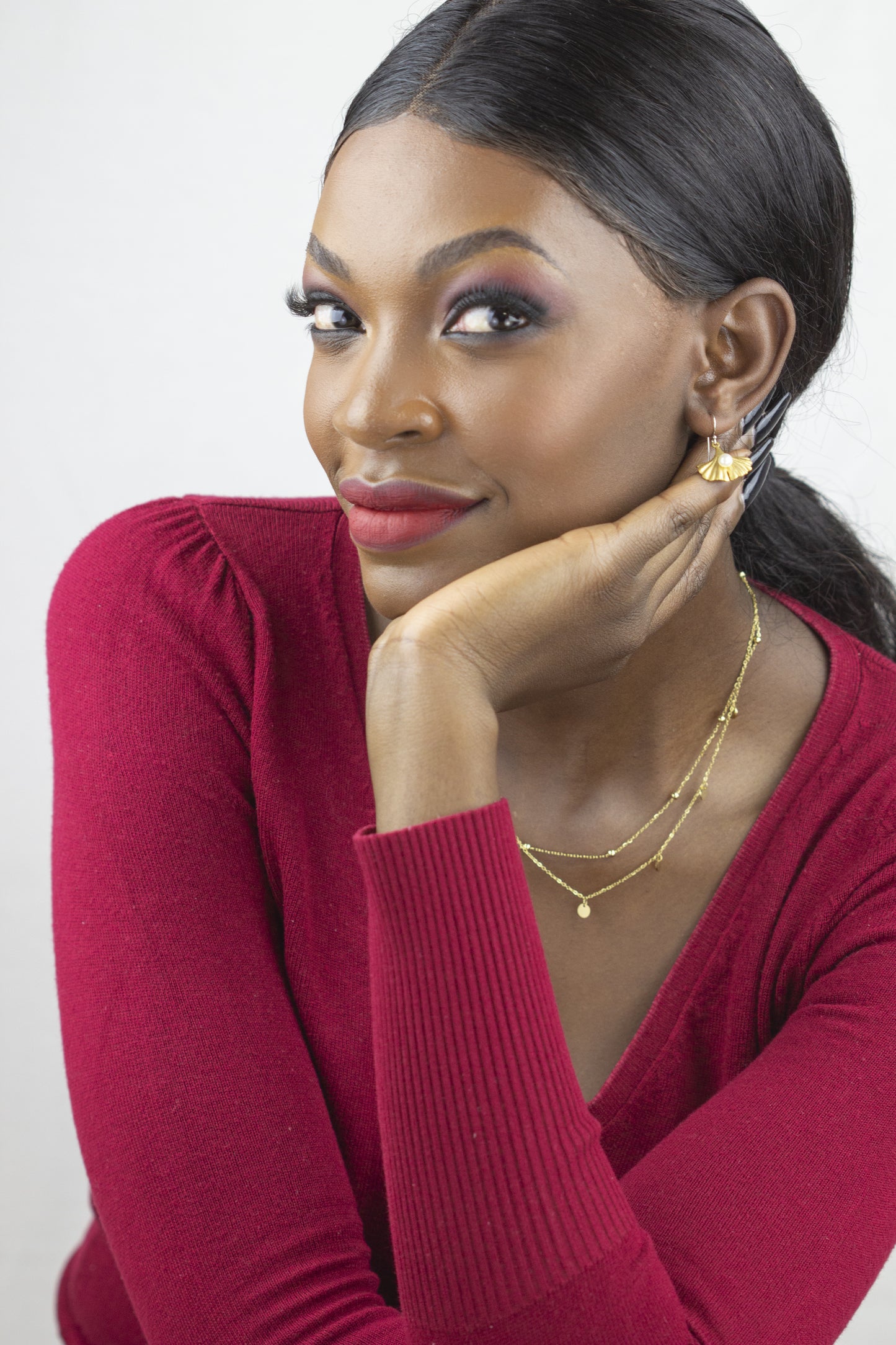 Elegant multi-layer gold Dahlia Jewels necklace on a model, featuring delicate bead accents, with free delivery in Nairobi for every jewelry lover.