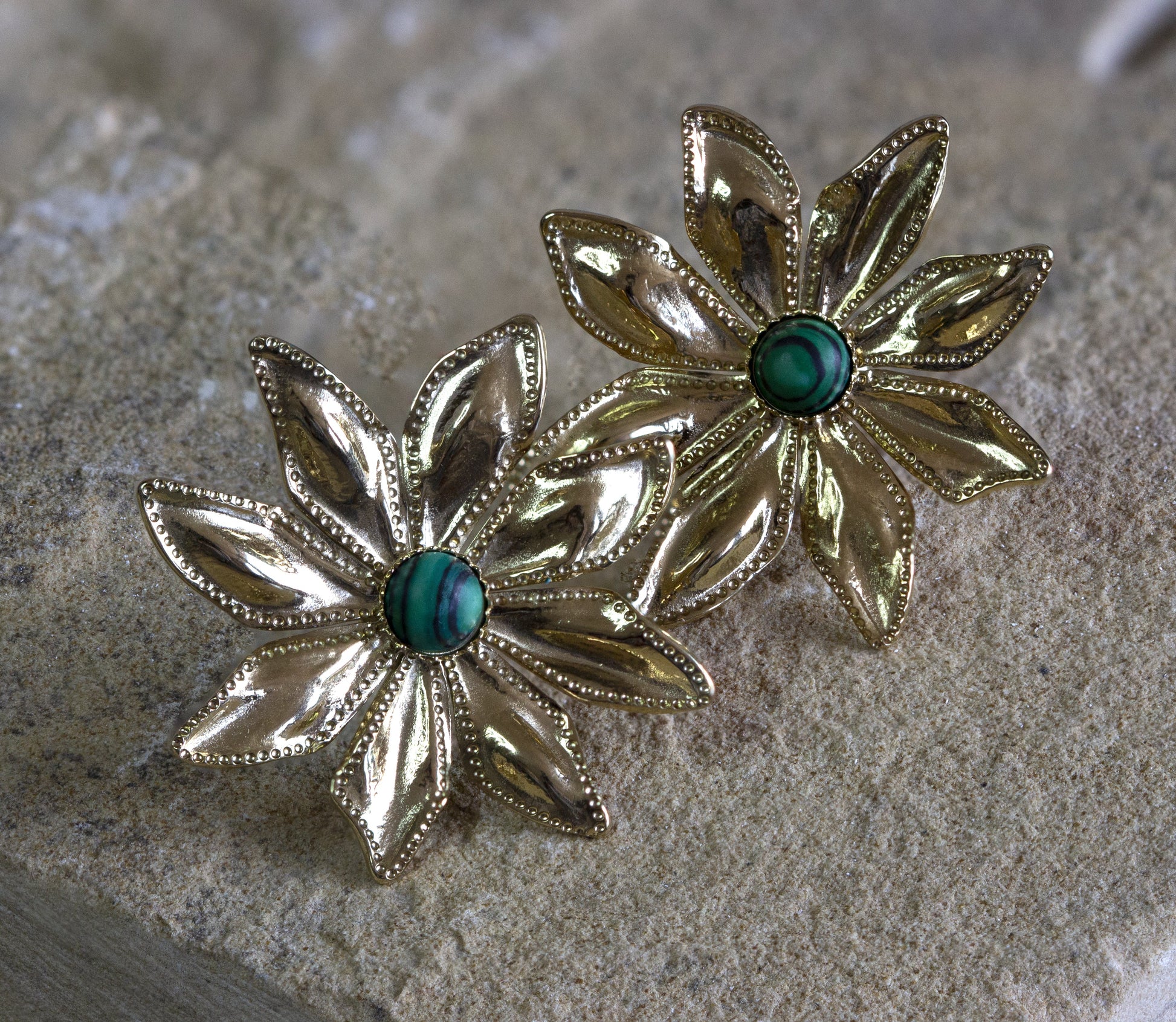 Dahlia Jewels presents enchanting gold-tone flower stud earrings with a central turquoise stone, offering a hint of nature-inspired beauty. Receive free delivery on this jewellery in Nairobi. #gorgeouseveryday