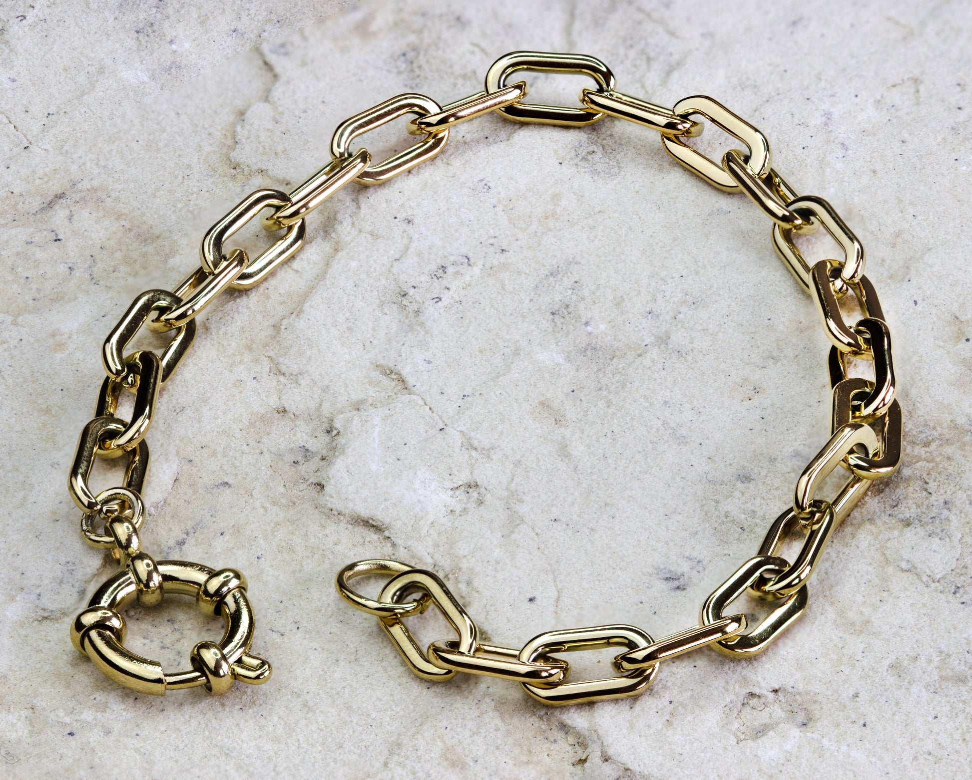 Elegant gold-plated link bracelet from Dahlia Jewels, crafted with slender, interlocking links and featuring a sophisticated toggle clasp for a secure and stylish fit. The design boasts a timeless appeal with its polished finish and classic silhouette, making it a versatile addition to any jewelry wardrobe. Ideal for both casual and formal settings. Available for free delivery in Nairobi. Keywords: jewellery, jewelry.