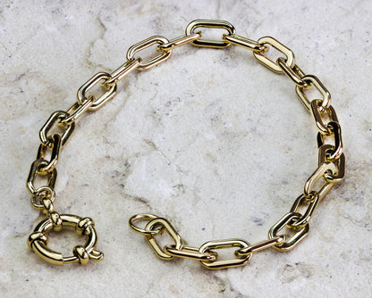 Elegant gold-plated link bracelet from Dahlia Jewels, crafted with slender, interlocking links and featuring a sophisticated toggle clasp for a secure and stylish fit. The design boasts a timeless appeal with its polished finish and classic silhouette, making it a versatile addition to any jewelry wardrobe. Ideal for both casual and formal settings. Available for free delivery in Nairobi. Keywords: jewellery, jewelry.