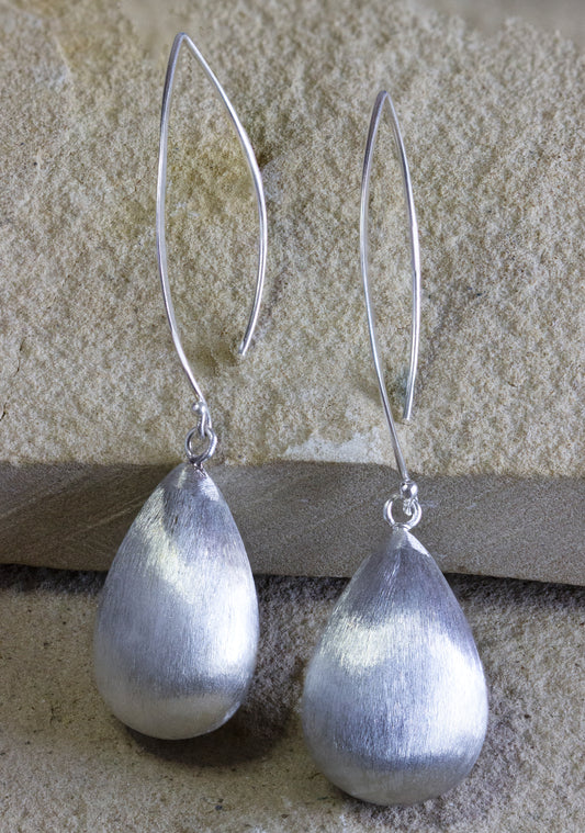 Embrace simplicity with Dahlia Jewels' silver drop earrings featuring a brushed teardrop pendant, perfect for an understated, yet refined look. Jewelry with free delivery in Nairobi. #gorgeouseveryday