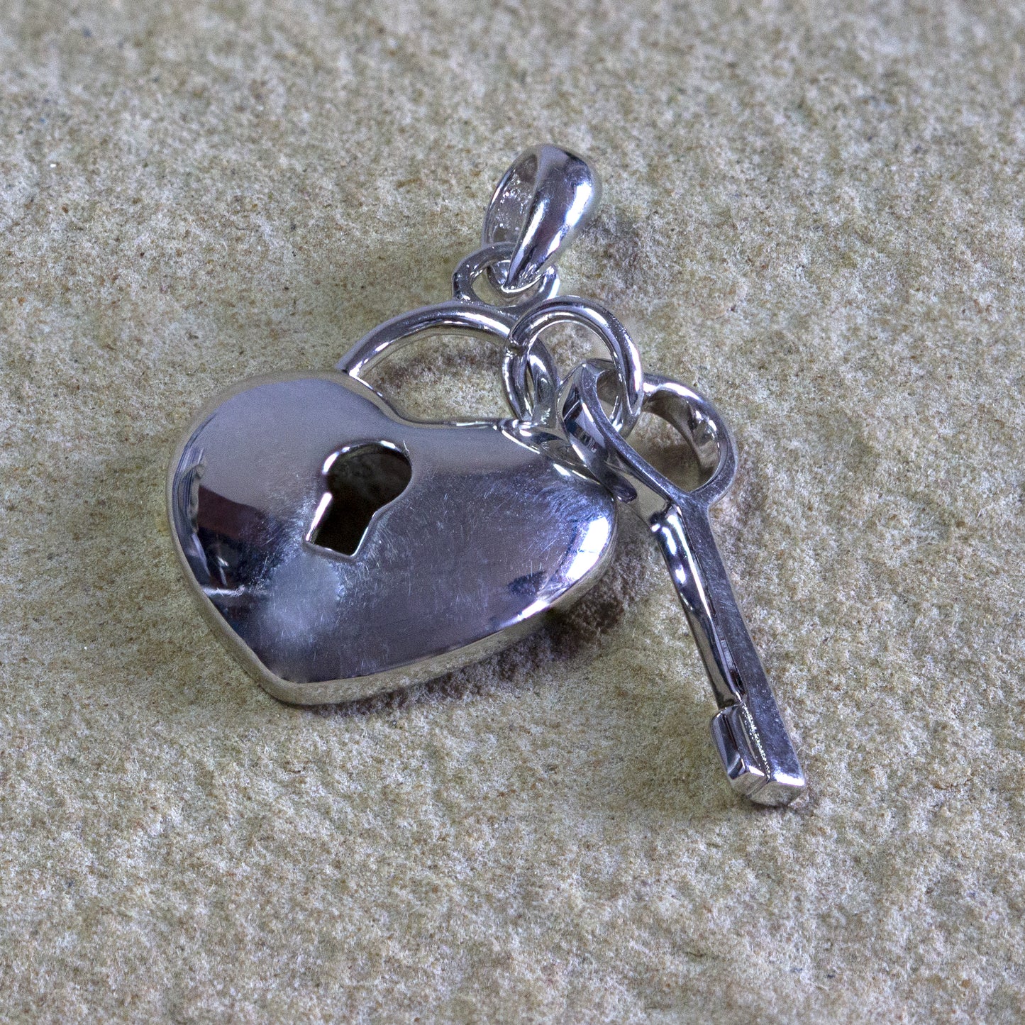 Sterling silver heart pendant with key, symbolizing unlocking love, a charming addition to any jewelry collection, Nairobi delivery, #gorgeouseveryday