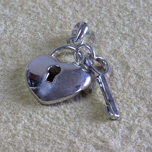 Sterling silver heart pendant with key, symbolizing unlocking love, a charming addition to any jewelry collection, Nairobi delivery, #gorgeouseveryday