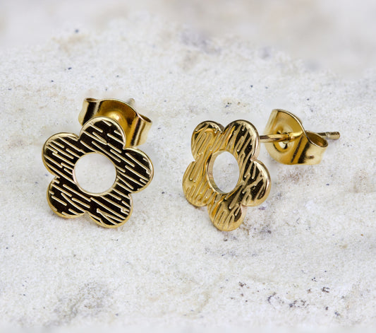 A pair of delicate gold stud earrings in the shape of a simple sring flower.  The earrings are cute and ideal fo weekend wear.  They are available   for free delivery within Nairobi. Keywords: jewelry, jewellery.