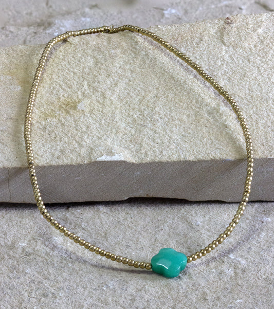 Delicate gold-plated necklace with a small turquoise gemstone, perfect for subtle jewelry elegance, shipped in Nairobi, #gorgeouseveryday