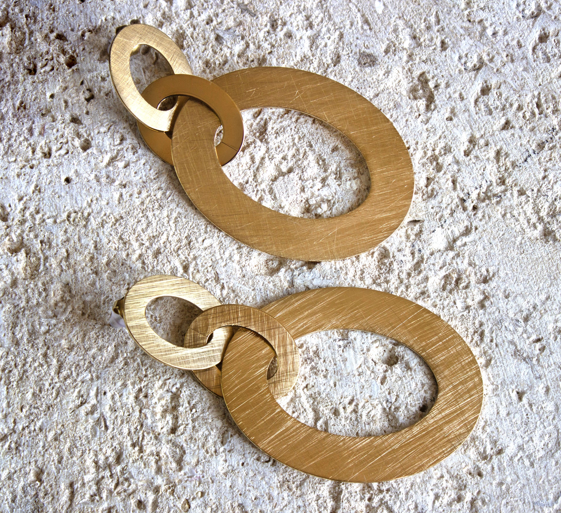 Oversized golden interlocking hoop earrings with a brushed finish, bold and contemporary, for free delivery in Nairobi #gorgeouseveryday