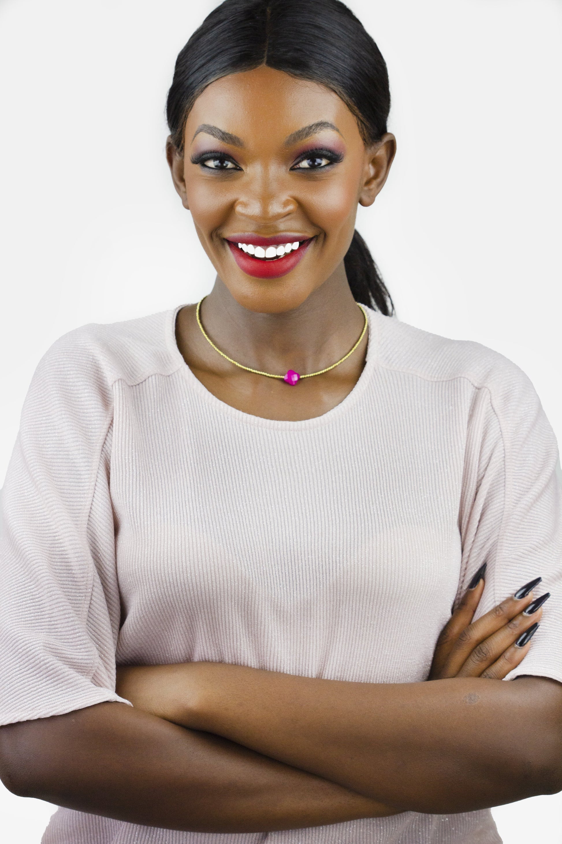 Dahlia Jewels brings you the epitome of elegance with their sleek gold choker and vibrant pendant. Enjoy free jewellery delivery in Nairobi!