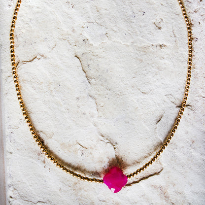 Trendsetting gold-plated necklace with a vibrant magenta stone pendant, a bold jewellery/jewelry statement by Dahlia Jewels, #gorgeouseveryday, Nairobi delivery.